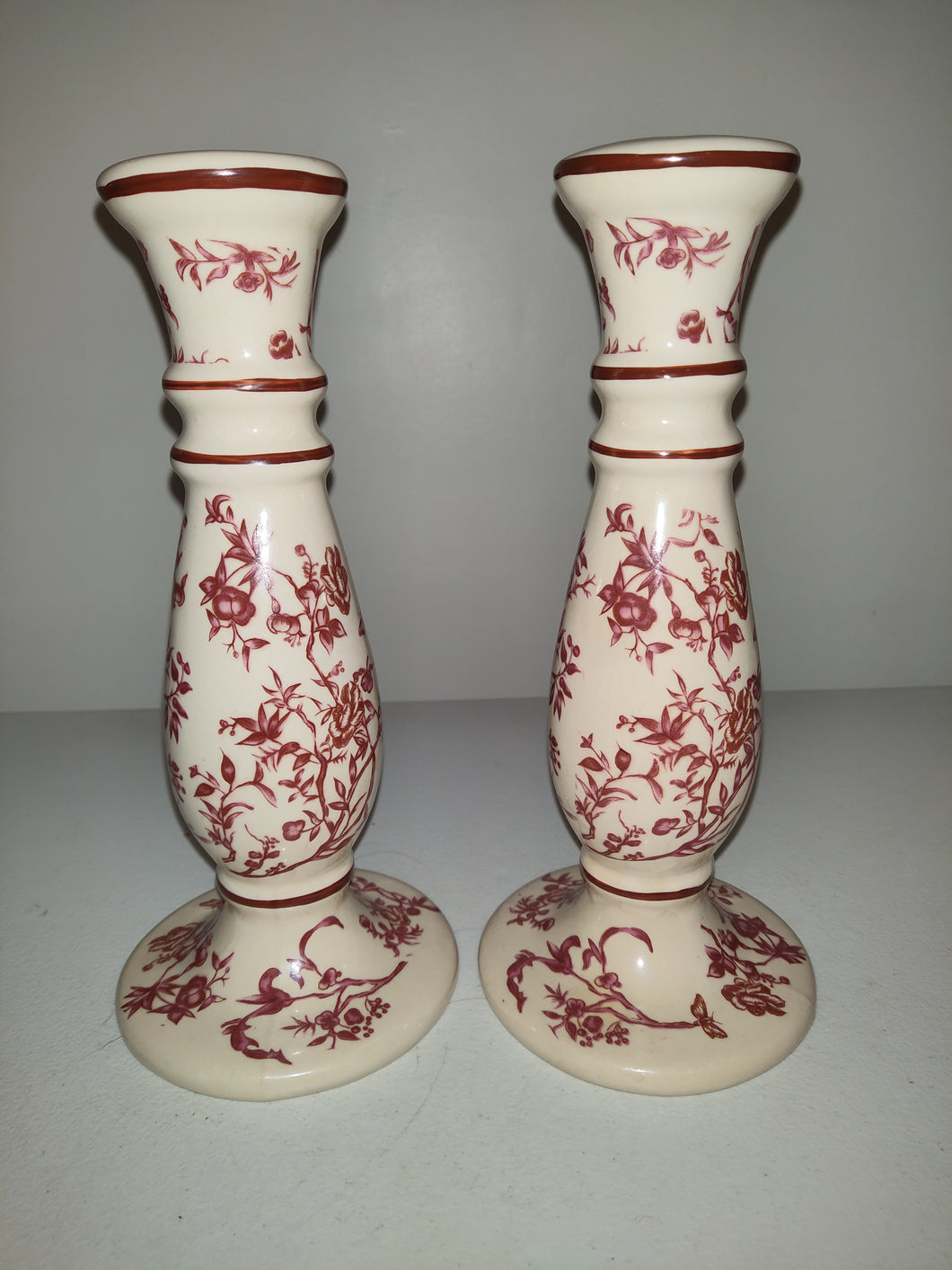 Two Burgandy Porcelain Candlestick Holders