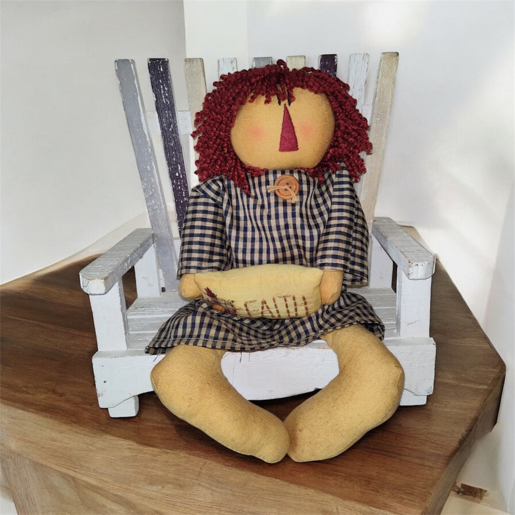 Primitive Doll Sitting On Bench