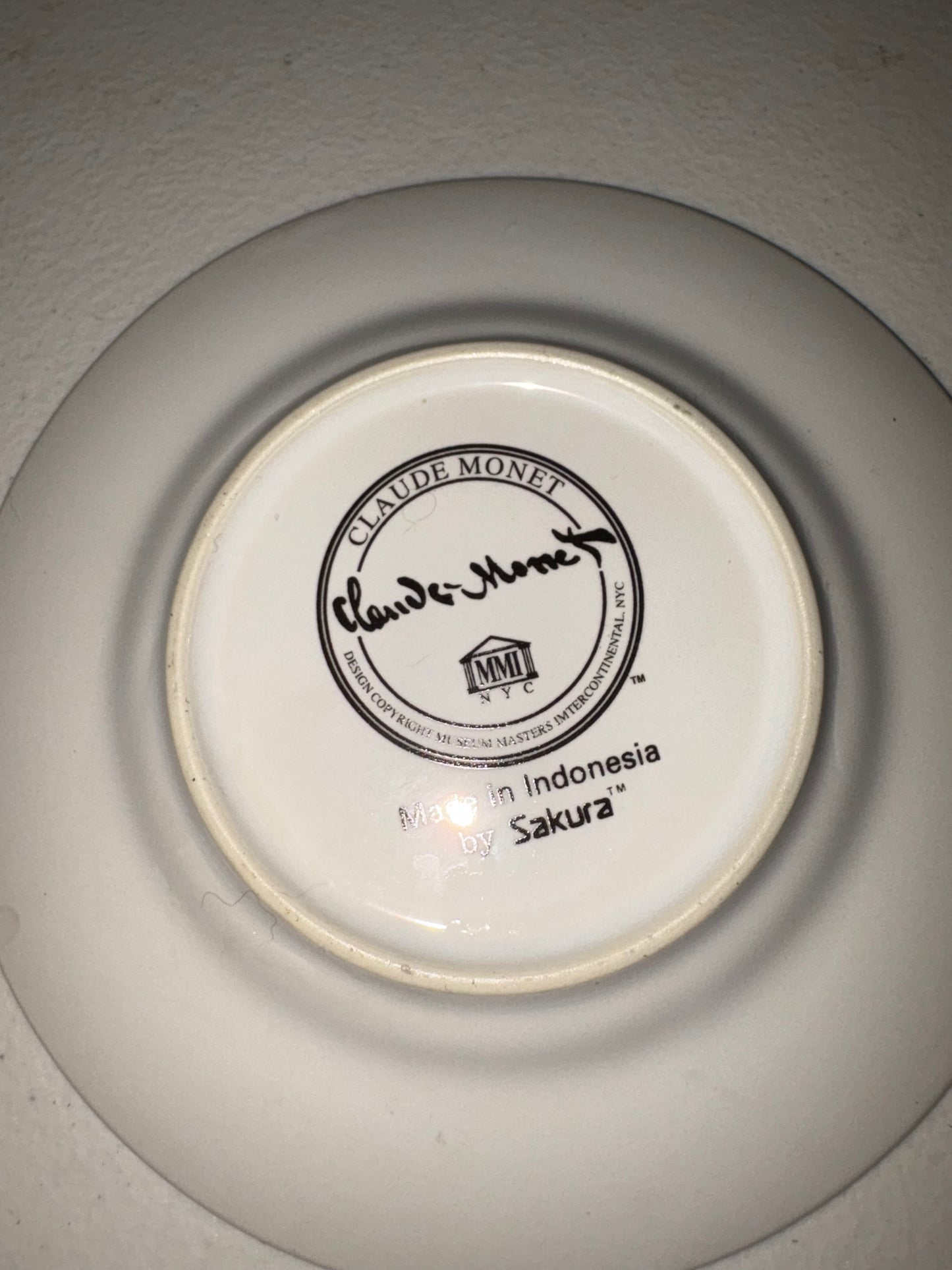 Taza y platillo de Claude Monet, maestros del Museo Sakura